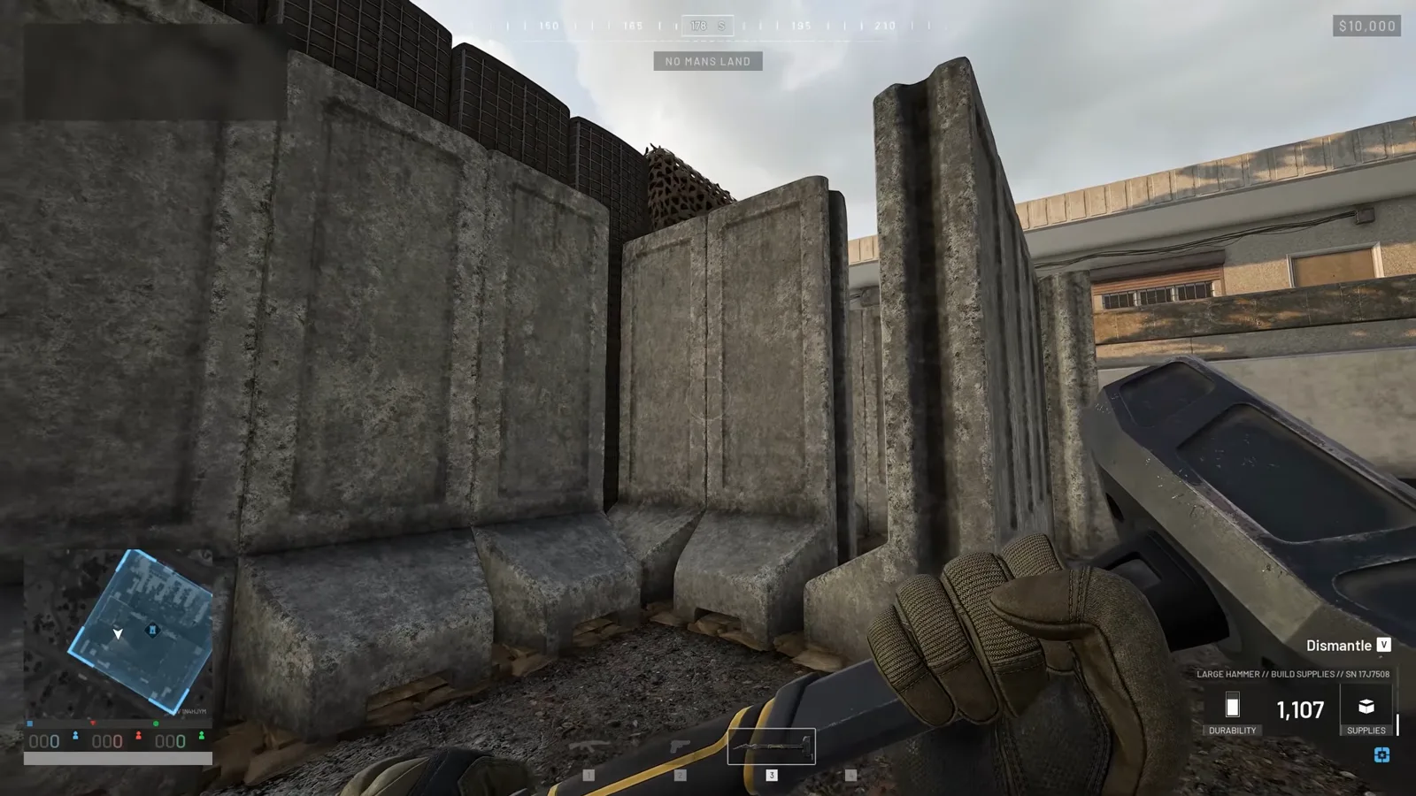 Staggered concrete Bremer blast walls shielding an infantry access tunnel into a forward base in WARDOGS