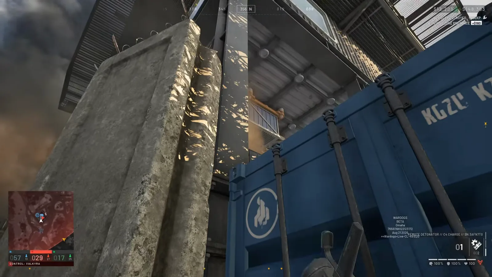 C4 charge with a remote detonator placed against a blue shipping container at the edge of a WARDOGS enemy FOB