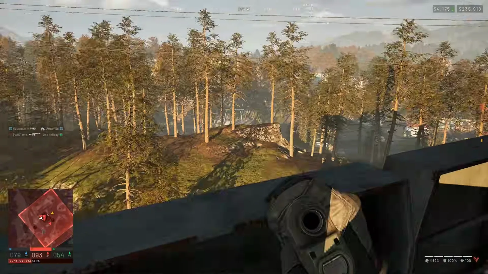 Elevated WARDOGS tower-top view looking out over a forested valley with a compound bow ready to catch incoming enemy reinforcements