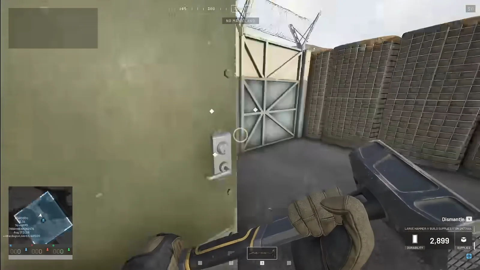 WARDOGS choke point door built into a wall line of Hesco barriers and barbed wire with the Dismantle V prompt and Large Hammer status readout open