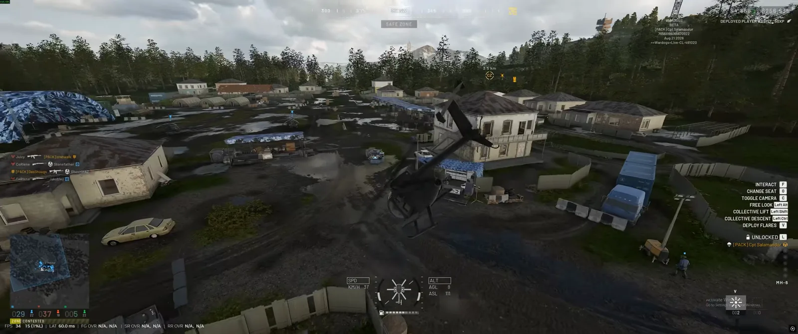 Helicopter settling gently onto flat terrain between shipping containers in WARDOGS with rotor wash kicking up dust at zero airspeed