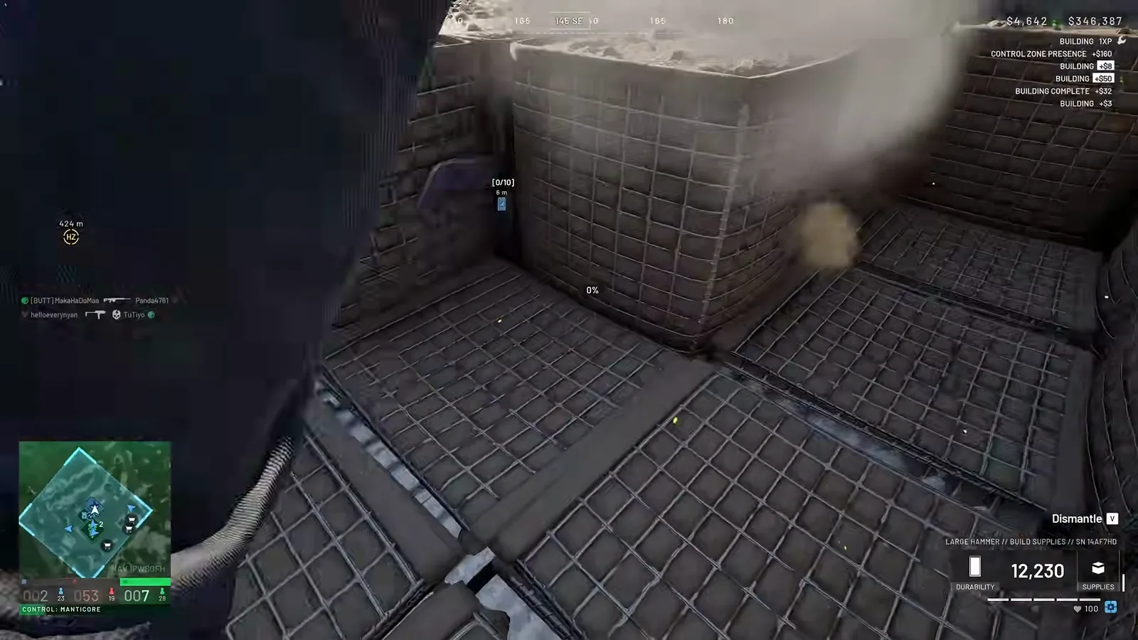 First-person WARDOGS view inside a narrow Hesco corridor between stacked Breacher roof walls while fortifying the APC garage upper deck against rocket splash